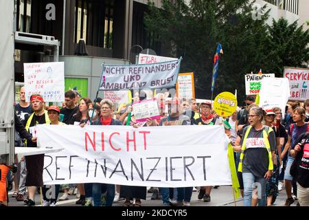 Hundreds of nursing staffs from six univeristy hospitals from North Rhine Westphalia continue their ninth week of the strike in front of State parlament in Duesseldorf, Germany on June 29, 2022 to demand a collective agreement from a new formed state government. (Photo by Ying Tang/NurPhoto) Stock Photo