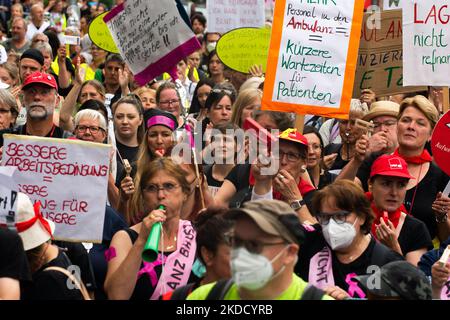 Hundreds of nursing staffs from six univeristy hospitals from North Rhine Westphalia continue their ninth week of the strike in front of State parlament in Duesseldorf, Germany on June 29, 2022 to demand a collective agreement from a new formed state government. (Photo by Ying Tang/NurPhoto) Stock Photo