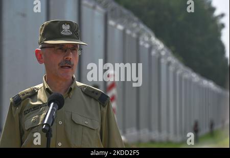 Major General Tomasz Praga, Chief Commandant of the Border Guard, during a press conference near the new fence on the Polish-Belarusian border near the village of Nowdziel. Prime Minister Mateusz Morawiecki (Center) appeared on the Polish-Belarusian border at the border wall, which the Polish government called a 'physical barrier'. He participated in the handover of this steel and concrete structure to the Border Guard, by the contractor of the project, Budimex, Unibep and Budrex companies. The border wall on the Polish-Belarusian border was built with the use of 50,000 tons of steel. It is 5. Stock Photo