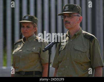 (L-R) Brigadier General Wioleta Gorzkowska, Deputy Chief Commandant of the Border Guard, and Major General Tomasz Praga, Chief Commandant of the Border Guard, during a press conference near the new fence on the Polish-Belarusian border near the village of Nowdziel. Prime Minister Mateusz Morawiecki (Center) appeared on the Polish-Belarusian border at the border wall, which the Polish government called a 'physical barrier'. He participated in the handover of this steel and concrete structure to the Border Guard, by the contractor of the project, Budimex, Unibep and Budrex companies. The border  Stock Photo