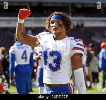 Florida safety Donovan McMillon (13) defends against Eastern Washington  wide receiver Efton Chism III (89) during the second half of an NCAA  college football game, Sunday, Oct. 2, 2022, in Gainesville, Fla. (