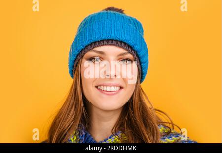 Smiling woman in warm knitted hat and scarf. Fashion winter clothes. Stock Photo