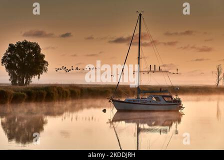 boat scenery on a foggy morning at baltic sea near Peenemuende Stock Photo