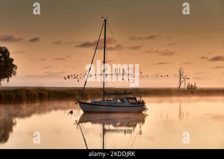 boat scenery on a foggy morning at baltic sea near Peenemuende Stock Photo