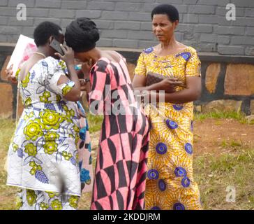 (Near) Kigali, Rwanda,  28th August, 2022    Local women on their Mobile smart phones chatting Stock Photo