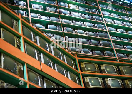 Old retro CRT TVs all over the wall Stock Photo