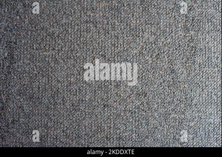 Carpet texture showing the weave of the fibers with no pile in a neutral beige, full frame textile background Stock Photo