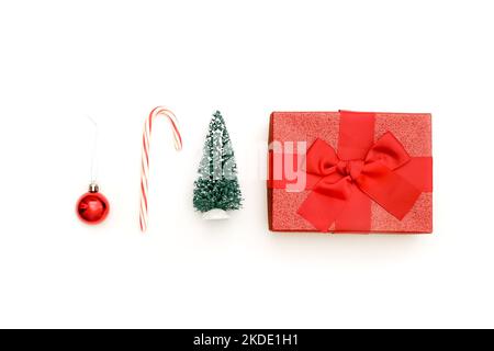 Christmas background with decorations and candies on white background, top view Stock Photo