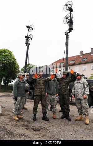 Soldier's from U.S. Army Europe's Alpha Battery, 5th Battalion, 7th Air Defense Artillery Regiment, familiarize members of the Polish military on how to conduct preventive maintenance on the Patriot missile systems in Morag, Poland, June 1, 2010. This is the first time a U.S. missile system has come to Poland for a new rotational training program intended to familiarize Polish armed forces on the Patriot Missile system. The training is designed to provide mutual benefits for improving Polish air defense capabilities while also developing the skills of U.S. patriot crew members. This type of mu Stock Photo