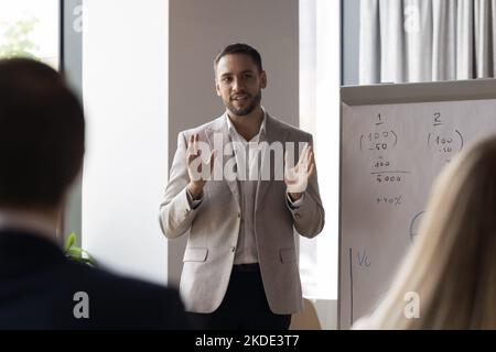Business trainer makes speech during professional training in office Stock Photo