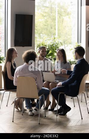 Staff meet in briefing for sharing ideas, working on project Stock Photo
