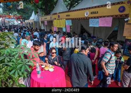 People enjoying traditional food from states of India during Saras Food Festival organized by Ministry of Rural Development at Baba Kharak Singh Marg, Connaught Place. Saras Food Festival is a unique example of women's empowerment. About 150 women entrepreneurs and members of self-help groups (self-help group is a financial intermediary committee usually composed of 12 to 25 local women between the ages of 18 and 50) from 17 states are participating in this event which gives them an opportunity to showcase their skill in the food industry. (Photo by Pradeep Gaur/SOPA Images/Sipa USA) Stock Photo