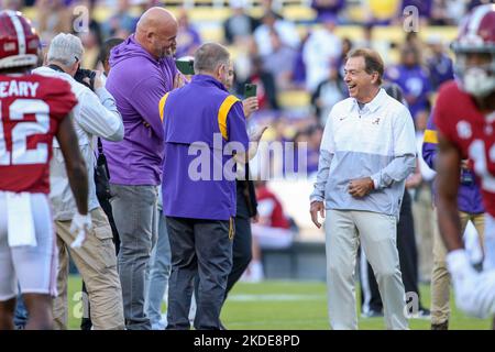 Former LSU head football coach, Ed Orgeron, right, talks to his girlfriend  Bailie Lauderdale during the third quarter of an NCAA college football game  between Texas A&M and Miami on Saturday, Sept.