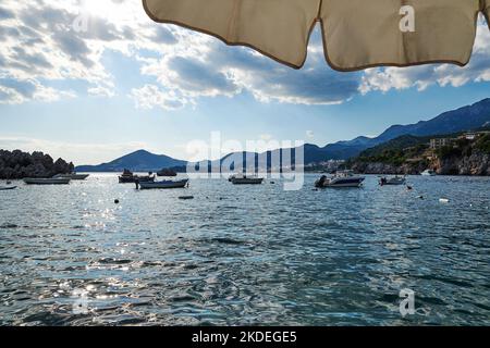 Sea bay with mountains and many fishing boats. Travel destinations Stock Photo