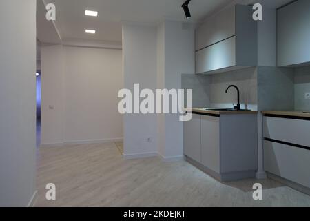 Modern kitchen interior in apartment buildings. Modern minimalist design. Stock Photo