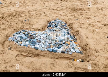 A heart made from pebbles found on Fistral Beach in Cornwall, UK Stock Photo