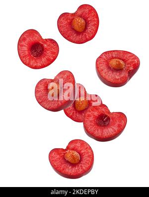 Falling cherry slice isolated on white background, full depth of field, clipping path Stock Photo