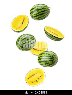 Falling yellow watermelon isolated on white background, clipping path, full depth of field Stock Photo