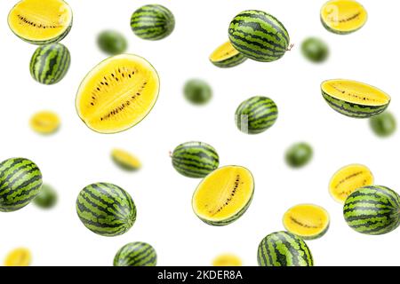 Falling yellow watermelon isolated on white background, selective focus Stock Photo