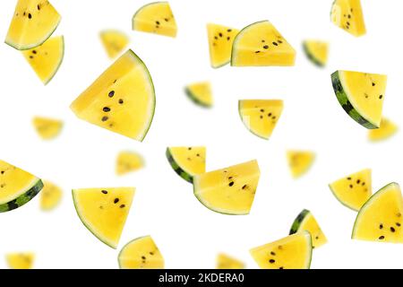 Falling yellow watermelon isolated on white background, selective focus Stock Photo