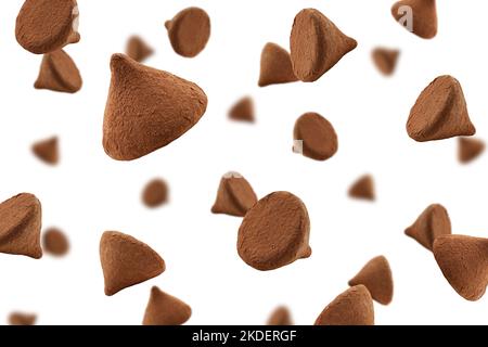 Falling chocolate truffles covered cocoa isolated on white background, selective focus Stock Photo