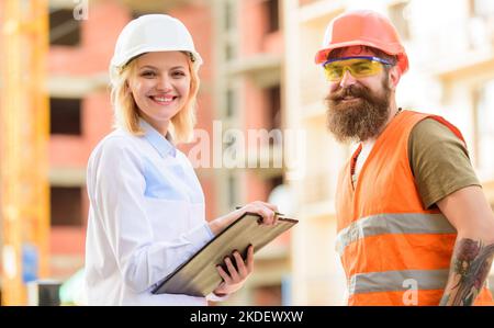 Expert and builder communicate about supply building materials. Successful deal concept. Purchase of building materials. Construction industry Stock Photo