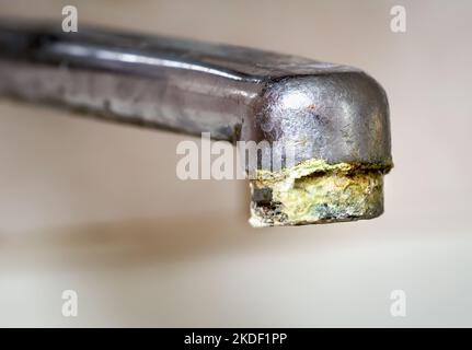 Chrome tap with unhigienic lime, calcium deposit from hard water in the kitchen Stock Photo