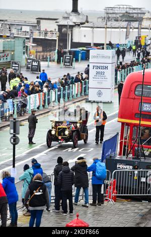 Brighton UK 6th November 2022 - Cars arrive on Brighton seafront on a wet and windy day after taking part in the annual RM Sotheby's London to Brighton Veteran Car Run today . The Run is open to four-wheeled cars, tri-cars and motor tricycles manufactured before 1st January 1905 : Credit Simon Dack / Alamy Live News Stock Photo
