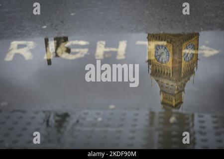 London, UK. 06th Nov, 2022. Big Ben and Parliament are reflected in puddles on at Parliament Square in the rainy weather. Credit: Imageplotter/Alamy Live News Stock Photo