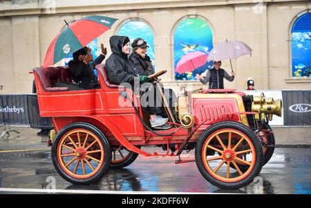 Brighton UK 6th November 2022 - Participants brave the torrential rain along  Brighton seafront as they complete the annual RM Sotheby's London to Brighton Veteran Car Run today . The Run is open to four-wheeled cars, tri-cars and motor tricycles manufactured before 1st January 1905 : Credit Simon Dack / Alamy Live News Stock Photo