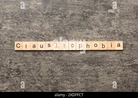 claustrophobia word written on wood block. claustrophobia text on table, concept. Stock Photo