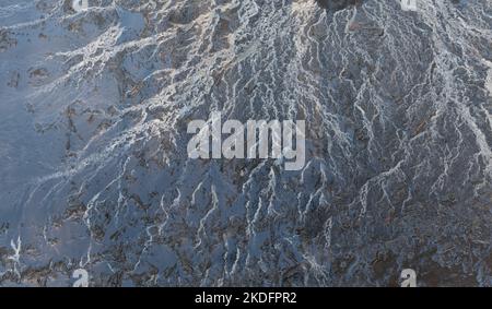 Blurred image of mud stream in thick puddle close-up Stock Photo