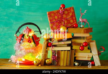 audio books as christmas gift,christmas present,reading,literature,education, holiday, concept.Christmas tree,decoration and christmas balls Stock Photo