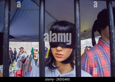 London, UK. 6th November 2022. Blindfolded mannequins await 'execution by hanging' in 'Evin Prison' at Trafalgar Square as demonstrations for Mahsa Amini and freedom in Iran continue. Credit: Vuk Valcic/Alamy Live News Stock Photo