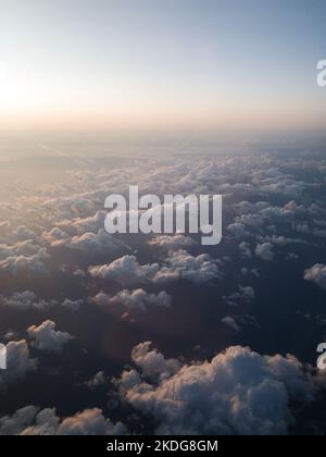 Cloudy sky during sunset seen from a plane Stock Photo