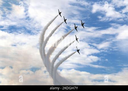 Kleine Brogel, Belgium - SEP 09, 2018: Breitling team formation flying with white smoke on an airshow at Kleine Brogel, Belgium. Stock Photo