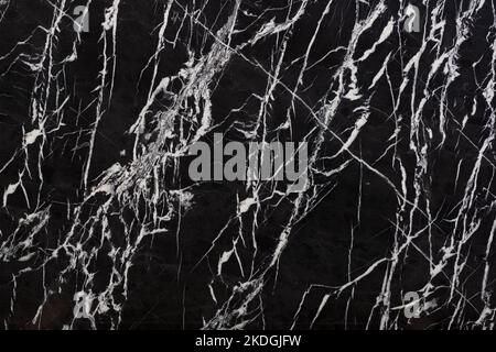 Bianco nero - natural marble stone texture. Dark pattern of marble, photo of slab. Wallpaper of natural granite stone. Closeup grunge surface, matte Stock Photo