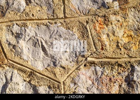 Old stone wall with cement tile pattern. Rough grunge background Stock Photo