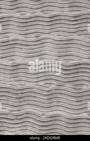 Abstract curvy cement pattern with waves on a plastered wall. Creative background Stock Photo