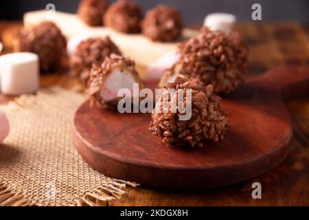 Homemade Caramel Marshmallows covered in chocolate flavor puffed rice, sweet treat easy to make, no baking required, ideal for parties and festivities Stock Photo