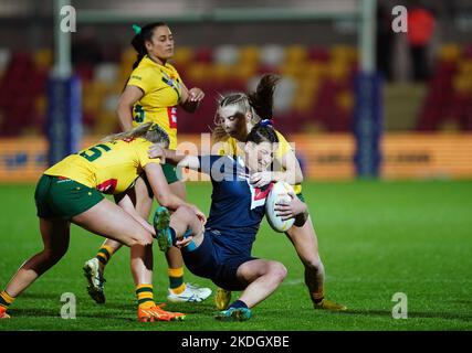 France's Manon Samarra tackled by Australia's Jaime Chapman and Tarryn Aiken during the Women's Rugby League World Cup Group B match at the LNER Community Stadium, York. Picture date: Sunday November 6, 2022. Stock Photo