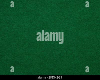 Dark green felt background of suede fabric surface. Texture for text, lettering, patchworkor other art. Full frame backdrop wallpaper of art and Stock Photo