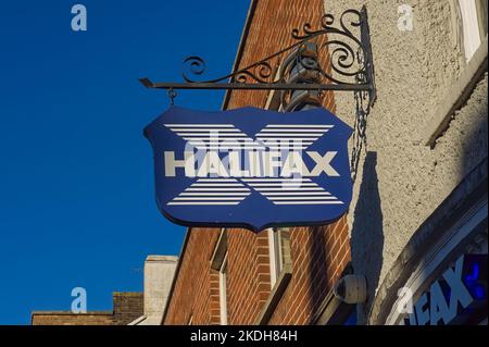 A vintage-style street sign for HALIFAX bank with blue sky in the background in Boston Lincolnshire Stock Photo