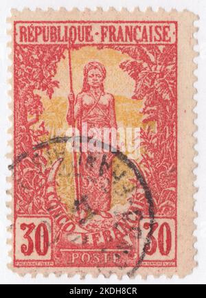 FRENCH CONGO - 1900: An 20 centimes yellow green and orange postage stamp depicting Bakalois Woman from Congo 1900 pictorial issue Stock Photo
