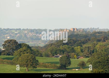 A View From the Peckforton Hills Over Woodland Looking Towards The Rocky Crags of Beeston Castle in Late Afternoon Autumn Sunshine Stock Photo