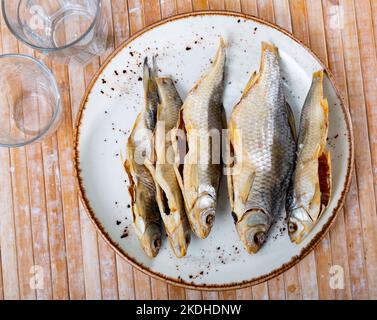 Dried roaches served on wooden table Stock Photo