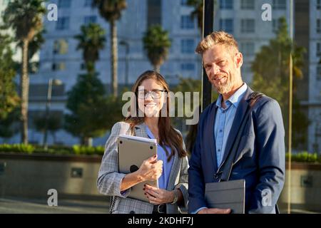 Business people dressed in formal wear looking at camera Stock Photo