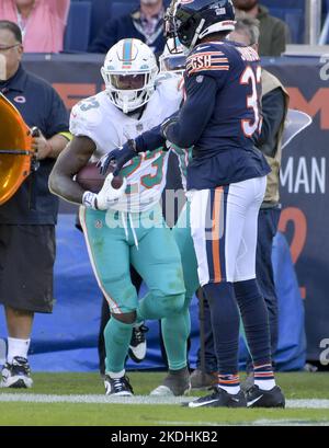 Miami Dolphins running back Jeff Wilson Jr. (23) runs with the ball past  New York Jets linebacker C.J. Mosley (57) during an NFL football game  against the New York Jets, Sunday, Jan.