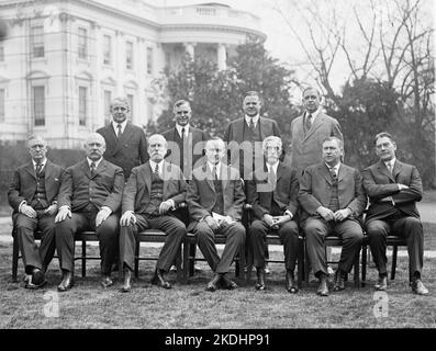 Coolidge's cabinet in 1924, outside the White House. Front row, left to right: Harry Stewart New, John W. Weeks, Charles Evans Hughes, Coolidge, Andrew Mellon, Harlan F. Stone, Curtis D. Wilbur. Back row, left to right: James J. Davis, Henry C. Wallace, Herbert Hoover, Hubert Work. Stock Photo