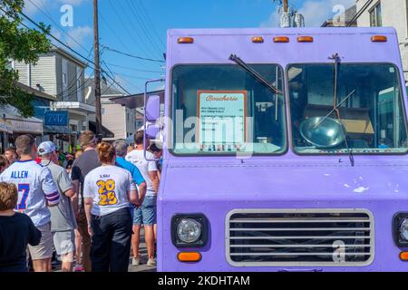 NEW ORLEANS, LA, USA - NOVEMBER 6, 2022: Boucherie food truck parked on Oak Street and the diverse crowd during the free Oak Street Po-Boy Festival Stock Photo